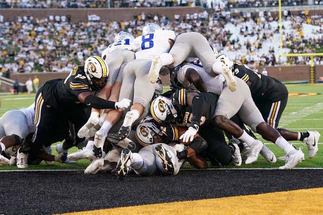 Sep 9, 2023; Columbia, Missouri, USA; Missouri Tigers quarterback Brady Cook (12) punches in for a touchdown against the Middle Tennessee Blue Raiders during the first half at Faurot Field at Memorial Stadium.