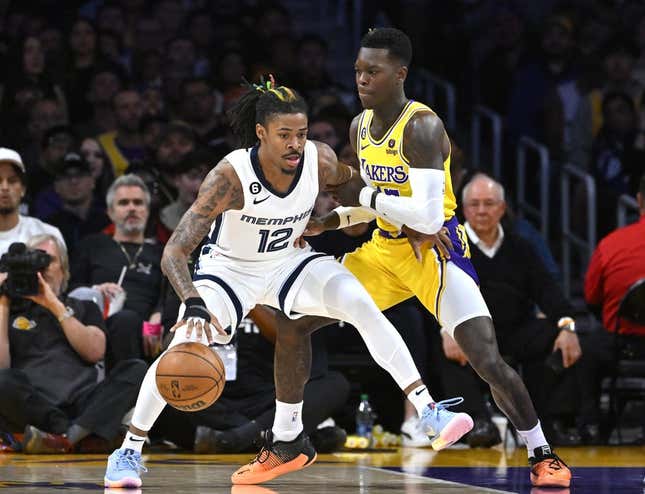 Apr 28, 2023; Los Angeles, California, USA; Los Angeles Lakers guard Dennis Schroder (17) defends Memphis Grizzlies guard Ja Morant (12) in the first half of game six of the 2023 NBA playoffs at Crypto.com Arena.