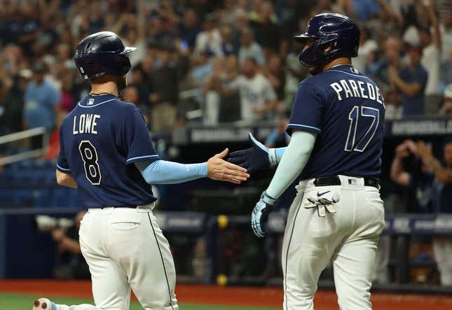 Sep 19, 2023; St. Petersburg, Florida, USA; Tampa Bay Rays second baseman Brandon Lowe (8) and third baseman Isaac Paredes (17) celebrate as they both score during the eighth inning against the Los Angeles Angels at Tropicana Field.