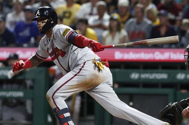 Aug 8, 2023; Pittsburgh, Pennsylvania, USA;  Atlanta Braves shortstop Orlando Arcia (11) hits a game winning two-run double against the Pittsburgh Pirates during the ninth inning at PNC Park. Atlanta won 8-6.