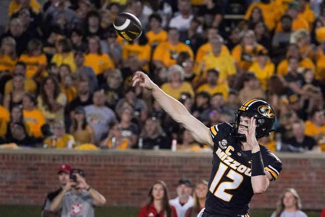 Aug 31, 2023; Columbia, Missouri, USA; Missouri Tigers quarterback Brady Cook (12) throws a pass against the South Dakota Coyotes during the first half at Faurot Field at Memorial Stadium.