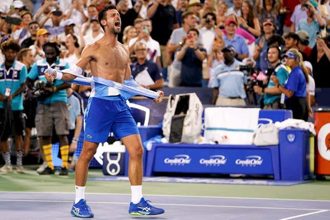 Novak Djokovic, of Serbia, rips his shirt in celebration after defeating Carlos Alcaraz, of Spain, at the conclusion of the men   s singles final of the Western &amp;amp; Southern Open tennis tournament, Sunday, Aug. 20, 2023, at the Lindner Family Tennis Center in Mason, Ohio. Djokovic won, 5-7, 7-6, 7-6.