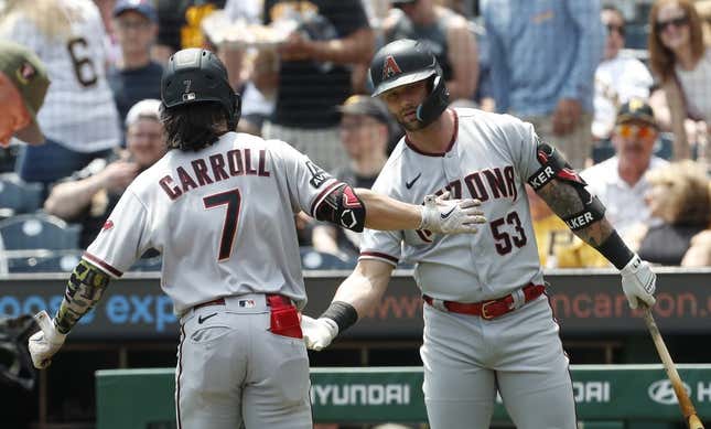 May 21, 2023; Pittsburgh, Pennsylvania, USA;  Arizona Diamondbacks first baseman Christian Walker (53) congratulates right fielder Corbin Carroll (7) crossing home plate on a solo home run against the Pittsburgh Pirates during the first inning at PNC Park.
