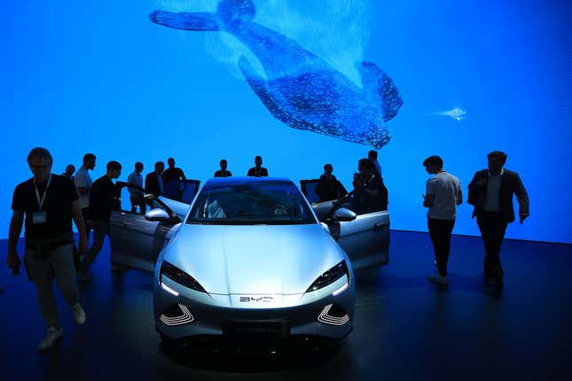 Visitors inspect a BYD Co. Seal electric sedan on day two of the Munich Motor Show (IAA) in Munich, Germany, on Wednesday, Sept. 6, 2023. Europe’s automakers are showing off their latest battery-powered vehicles at the IAA Mobility car show this week as they try to challenge Tesla Inc. and fend off growing competition from China. 
