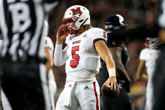 Miami (Oh) RedHawks quarterback Brett Gabbert (5) holds the ball between plays during the NCAA football game between the Cincinnati Bearcats and the Miami RedHawks at Nippert Stadium in Cincinnati on Saturday, Sept. 16, 2023.