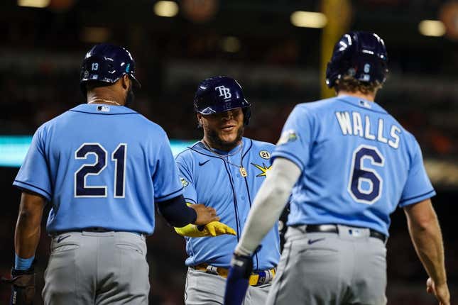 Sep 15, 2023; Baltimore, Maryland, USA; Tampa Bay Rays designated hitter Harold Ramirez (43) celebrates with center fielder Manuel Margot (13) and third baseman Taylor Walls (6) after hitting a three run home run against the Baltimore Orioles during the sixth inning at Oriole Park at Camden Yards.