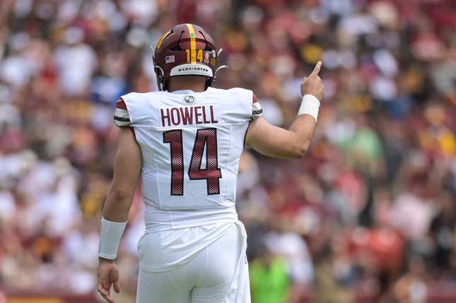 Sep 10, 2023; Landover, Maryland, USA; Washington Commanders quarterback Sam Howell (14) signals first down during the first quarter against the Arizona Cardinals  at FedExField.