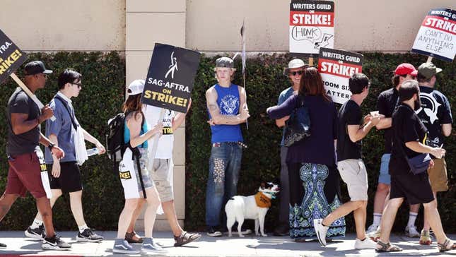 Striking WGA and SAG-AFTRA members outside of Warner Bros. Studio in Burbank, CA.
