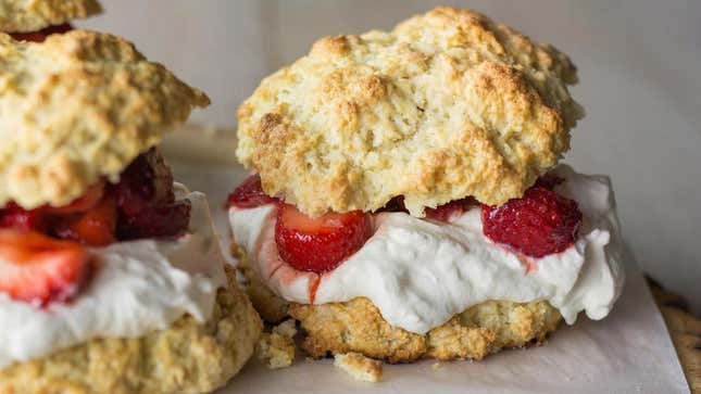 strawberry raspberry shortcake on biscuit base with whipped cream