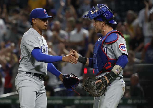 Aug 24, 2023; Pittsburgh, Pennsylvania, USA;  Chicago Cubs relief pitcher Adbert Alzolay (73) and catcher Yan Gomes (15) shake hands after defeating the Pittsburgh Pirates at PNC Park.