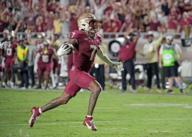 Sep 9, 2023; Tallahassee, Florida, USA; Florida State Seminoles defensive back Jarrian Jones (7) intercepts a pass and takes it for a touchdown during the game against the Southern Miss Golden Eagles at Doak S. Campbell Stadium.
