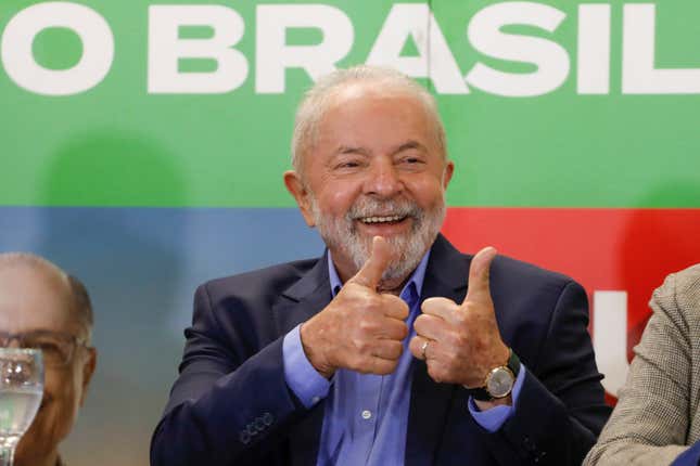 Brazilian president Lula smiling and giving a thumbs up.