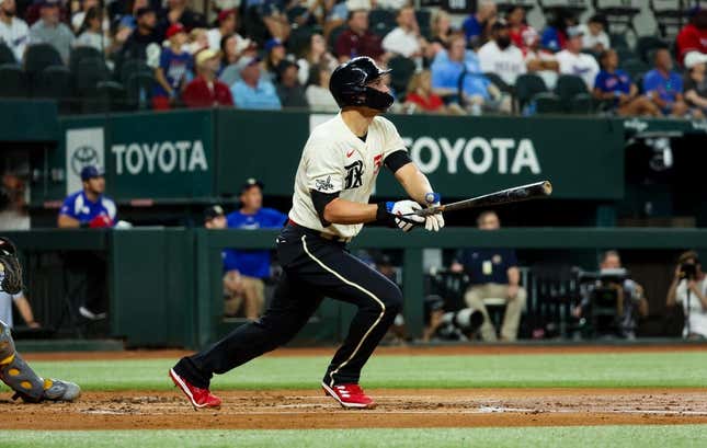 Sep 8, 2023; Arlington, Texas, USA;  Texas Rangers shortstop Corey Seager (5) hits a two-run home run during the first inning against the Oakland Athletics at Globe Life Field.