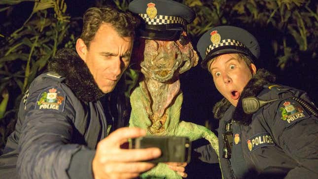 Wellington Paranormal's two cop characters pose for a selfie with an alien in the comedy series' second episode.