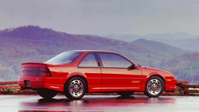 A photo of a red Chevrolet Beretta.