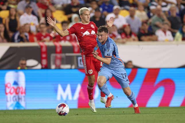 Aug 3, 2023; Harrison, NJ, USA; New York City FC midfielder Matias Pellegrini (17) plays the ball against New York Red Bulls defender Andres Reyes (4) during the second half at Red Bull Arena.