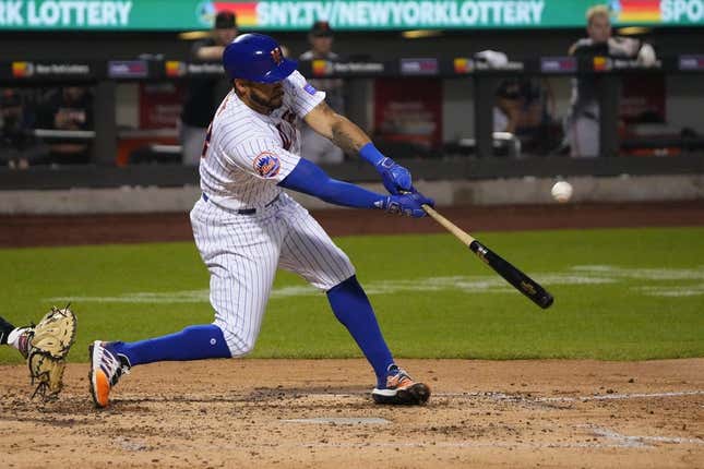 Jul 2, 2023; New York City, New York, USA; New York Mets left fielder Tommy Pham (28) hits an RBI double against the San Francisco Giants during the fourth inning at Citi Field.