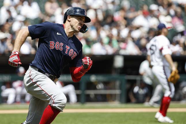 Jun 25, 2023; Chicago, Illinois, USA; Boston Red Sox center fielder Adam Duvall (18) runs after hitting an RBI-double against the Chicago White Sox during the third inning at Guaranteed Rate Field.