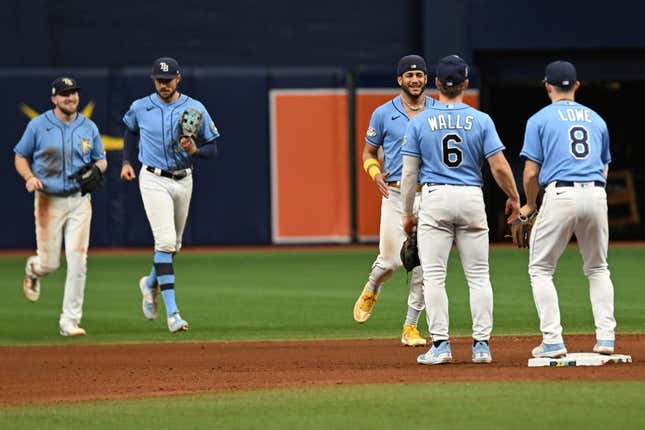 Sep 10, 2023; St. Petersburg, Florida, USA; Members of the Tampa Bay Rays celebrate after defeating the Seattle Mariners  at Tropicana Field.