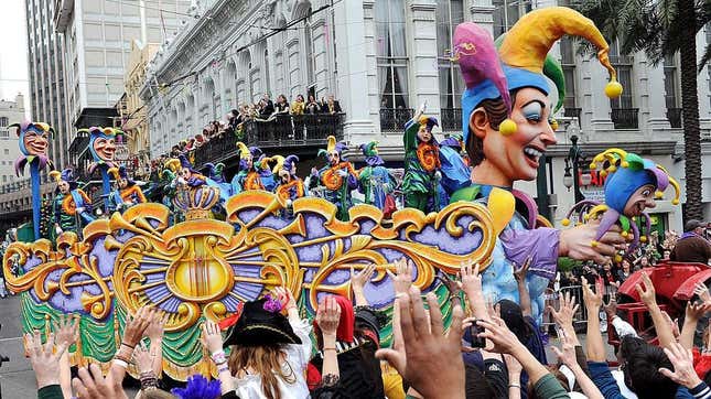 New Orleans Mardi Gras parade float in crowd