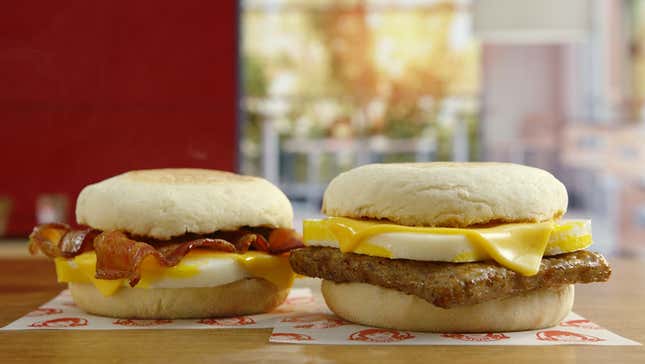 two breakfast sandwiches on table