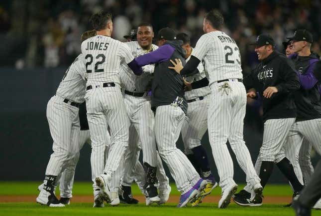 Sep 15, 2023; Denver, Colorado, USA; Colorado Rockies first baseman Elehuris Montero (44) and Colorado Rockies left fielder Nolan Jones (22) and Colorado Rockies designated hitter Kris Bryant (23) celebrate defeating the San Francisco Giants in the ninth inning at Coors Field.