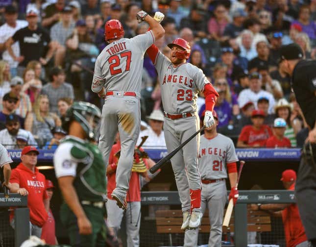 Jun 24, 2023; Denver, Colorado, USA; Los Angeles Angels center fielder Mike Trout (27) celebrates his home run with Los Angeles Angels second baseman Brandon Drury (23) in the third inning against the Colorado Rockies at Coors Field.