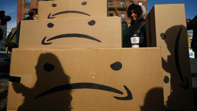 Boxes with the Amazon logo turned into a frown face are stacked up after a protest against Amazon in the Long Island City neighborhood of the Queens borough on November 14, 2018 in New York City.