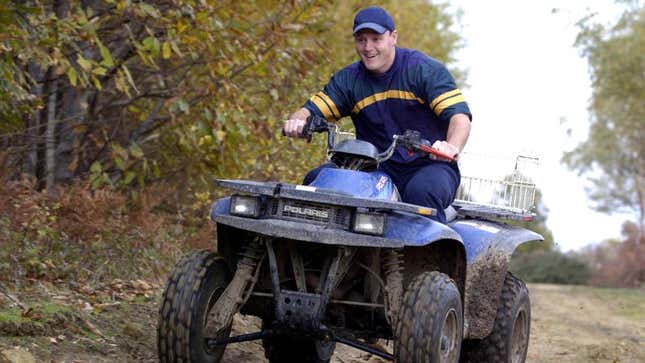 Image for article titled Guy Riding ATV Has Really Been Looking Forward To Breaking His Neck On Wooded Trail