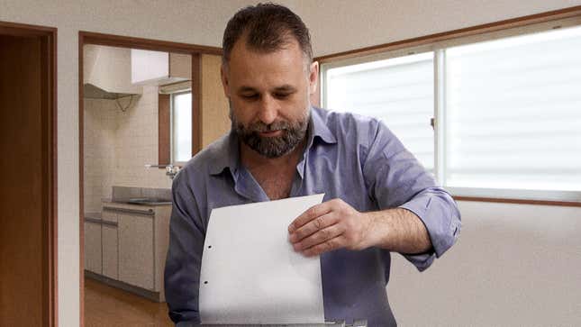 Image for article titled Dad Shredding Old Junk Mail With Intensity Of Watergate 7