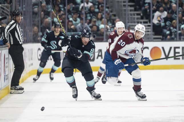 Apr 24, 2023; Seattle, Washington, USA; Seattle Kraken forward Daniel Sprong (91) and Colorado Avalanche forward Lars Eller (20) battle for the puck during the first period in game four of the first round of the 2023 Stanely Cup Playoffs at Climate Pledge Arena.