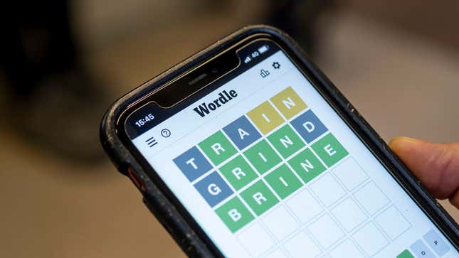 A person plays Wordle on an iPhone, one of the best browser games of 2022.