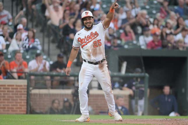 May 30, 2023; Baltimore, Maryland, USA;  Baltimore Orioles right fielder Anthony Santander (25) reacts after scoring on left fielder Austin Hays (not pictured) sacrifice fly during the second inning against the Cleveland Guardians at Oriole Park at Camden Yards.