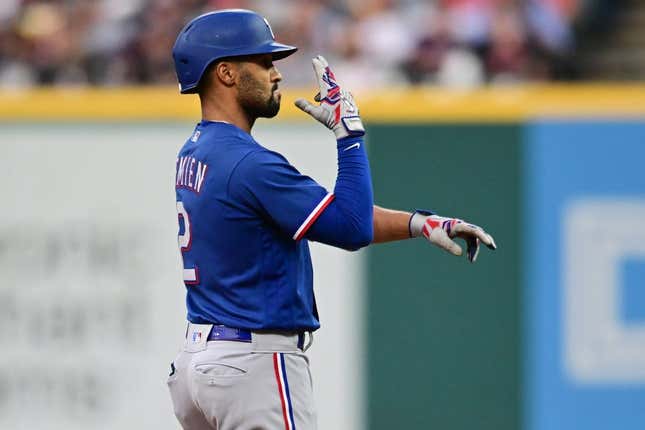Sep 16, 2023; Cleveland, Ohio, USA; Texas Rangers second baseman Marcus Semien (2) celebrates after hitting an RBI double during the fifth inning against the Cleveland Guardians at Progressive Field.