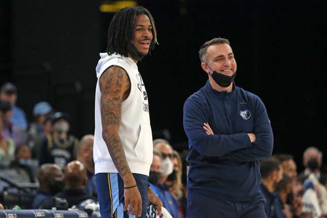 Jan 13, 2022; Memphis, Tennessee, USA; Memphis Grizzles guard Ja Morant (left) and acting head coach Darko Rajakovic (right) react to a foul call during the first half against the Minnesota Timberwolves at FedExForum.