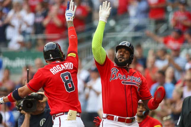 Eddie Rosario of the Atlanta Braves celebrates with Marcell Ozuna