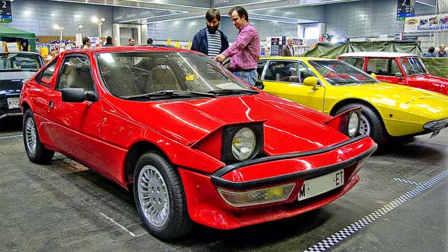A photo of a red Matra Murena in a museum. 