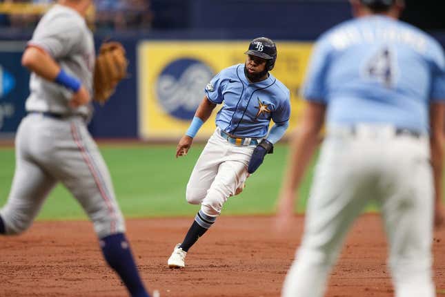 Jun 11, 2023; St. Petersburg, Florida, USA;  Tampa Bay Rays right fielder Manuel Margot (13) rounds third base to score a run against the Texas Rangers in the second inning at Tropicana Field.