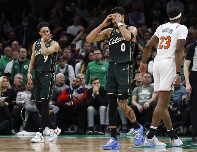Mar 5, 2023; Boston, Massachusetts, USA; Boston Celtics forward Jayson Tatum (0) and guard Derrick White (9) react to a foul being called against the Celtics during the overtime period against the New York Knicks at TD Garden.