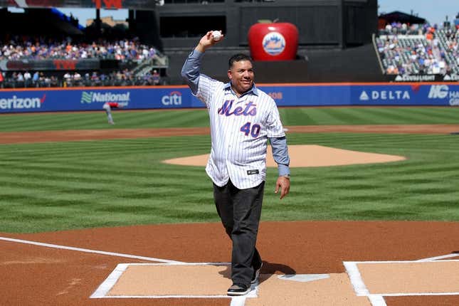 Sep 17, 2023; New York City, New York, USA; New York Mets former pitcher Bartolo Colon waves after throwing out a ceremonial first pitch before a game against the Cincinnati Reds at Citi Field. Colon today retired from baseball as a Met.