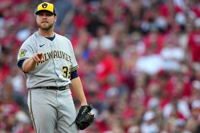 Milwaukee Brewers starting pitcher Corbin Burnes (39) works on his motion during a mound visit in the first inning during a baseball game between the Milwaukee Brewers and the Cincinnati Reds, Friday, July 14, 2023, at Great American Ball Park in Cincinnati.