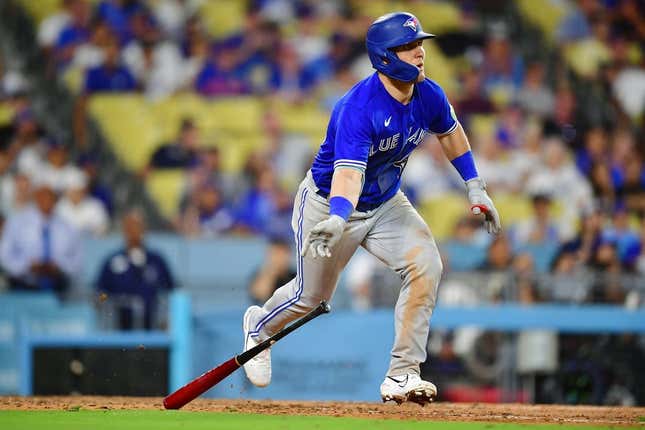 Jul 24, 2023; Los Angeles, California, USA; Toronto Blue Jays left fielder Daulton Varsho (25) hits a two run RBI double against the Los Angeles Dodgers during the eleventh inning  at Dodger Stadium.