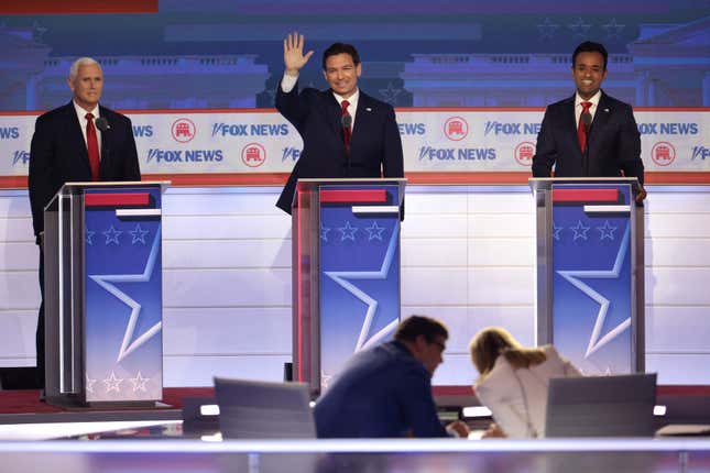MILWAUKEE, WISCONSIN - AUGUST 23: Republican presidential candidates (L-R), former U.S. Vice President Mike Pence, Florida Gov. Ron DeSantis and Vivek Ramaswamy take the stage for the first debate of the GOP primary season hosted by FOX News at the Fiserv Forum on August 23, 2023 in Milwaukee, Wisconsin.