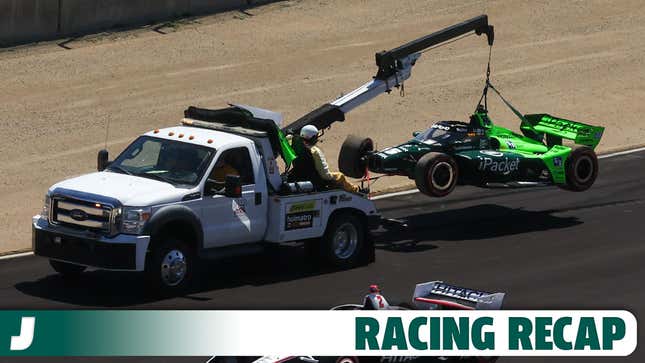 Graham Rahal's car being hoisted by a tow truck during the Grand Prix of Monterey