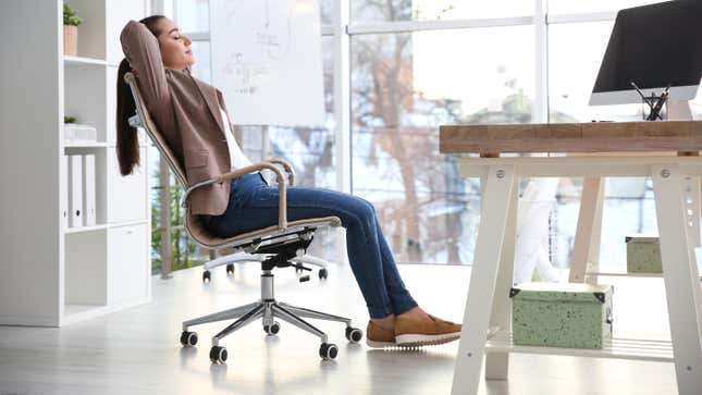 Woman relaxing in office chair