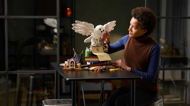 A woman works on the commemorative LEGO set