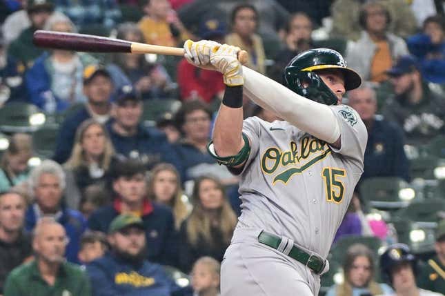 Jun 11, 2023; Milwaukee, Wisconsin, USA; Oakland Athletes left fielder Seth Brown (15) hits a 3-run home run against the Milwaukee Brewers in the fourth inning at American Family Field.