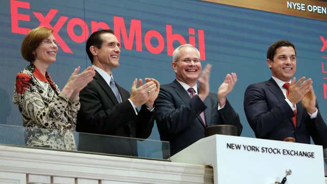 Exxon management clapping at the New York Stock Exchange.