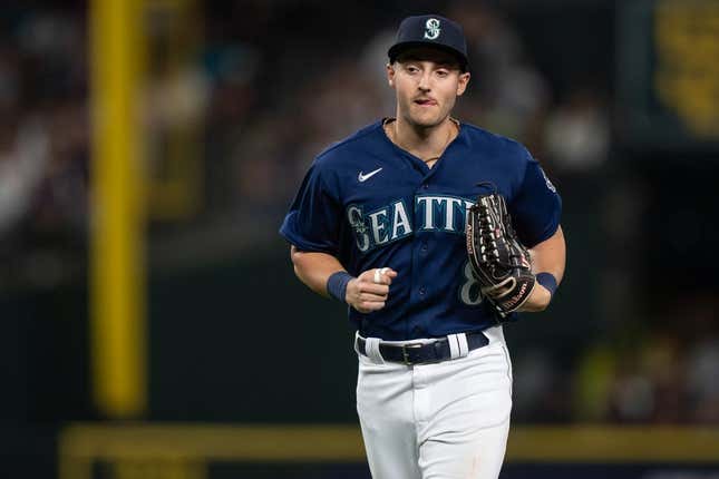 Aug 8, 2023; Seattle, Washington, USA; Seattle Mariners left fielder Dominic Canzone (8) jogs off the field during a game against the San Diego Padres at T-Mobile Park.