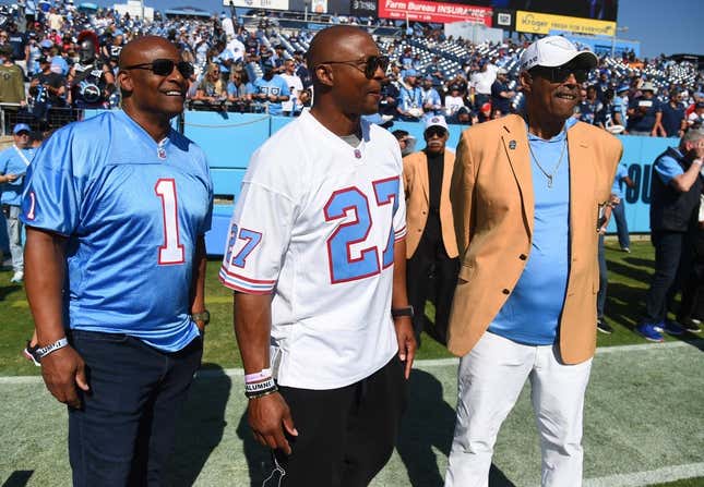 Oct 23, 2022; Nashville, Tennessee, USA; Former Houston Oilers quarterback Warren Moon (1), Tennessee Titans running back Eddie George (27) and NFL Hall of Famer Robert Brazile watch warmups before the game against the Indianapolis Colts at Nissan Stadium.